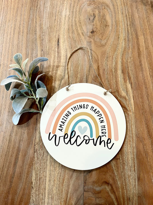 Welcome amazing things happen here hanging circle sign
